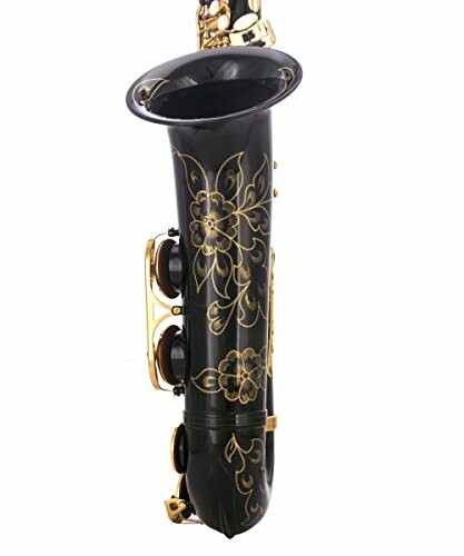 Black saxophone with gold floral engraving.