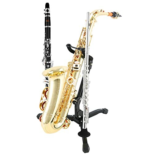 A saxophone, clarinet, and flute on a stand