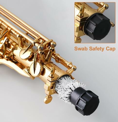 Saxophone cleaning brush with safety cap attached.