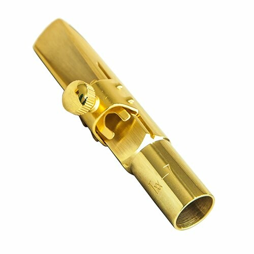 Gold saxophone mouthpiece on white background