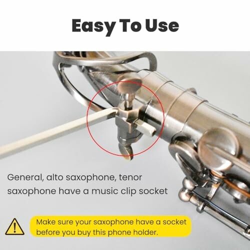 Saxophone with music clip socket for phone holder